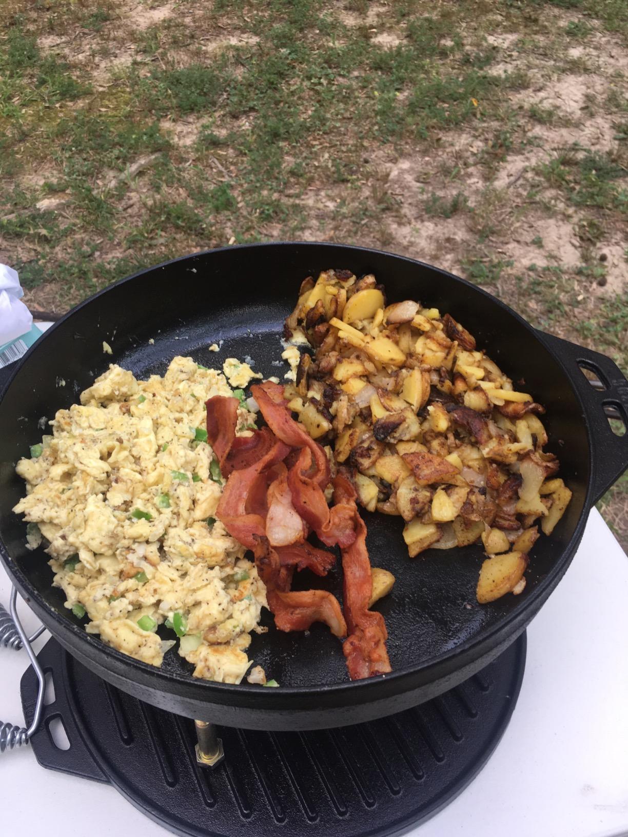 Lodge Cast Iron Cook-It-All Kit. Five-Piece Cast Iron Set includes a Reversible Grill/Griddle 14 Inch, 6.8 Quart Bottom/Wok, Two Heavy Duty Handles, and a Tips & Tricks Booklet. customer photo 2